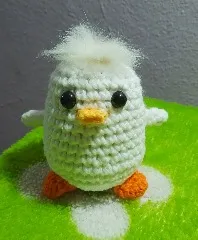 Pollito verde despeinado tejido a crochet